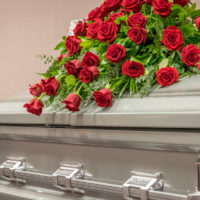 Roses on Top of Funeral Casket