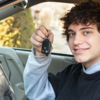 Boy holding a pair of keys