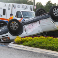 White car rolled over White car rolled over