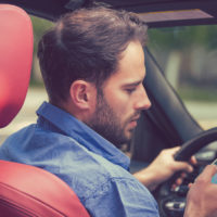 Male driver distracted Male driver distracted