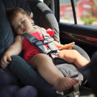 Child sleeping in car seat