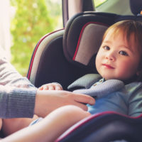 Toddler girl in her car seat