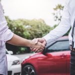 Insurance Agent and customer shaking hands after claim contact, Traffic Accident and insurance concept