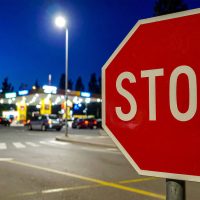 Red Octagonal STOP Sign at Roadside for Traffic Control