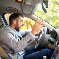 Really angry driver behind the steering wheel Really angry driver behind the steering wheel