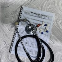 Concept of Wrongful Death write on document isolated on Wooden Table. Concept of Wrongful Death write on document isolated on Wooden Table.