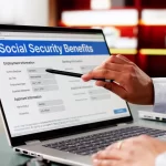 a-person-points-at-a-laptop-screen-displaying-a-social-security-benefits-webpage