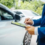 a-person-in-a-blue-suit-uses-a-tablet-with-a-stylus
