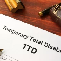 document-titled-temporary-total-disability-on-a-wooden-desk