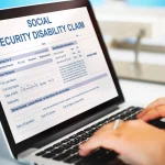 hands-type-on-a-laptop-displaying-a-social-security-disability-claim-form