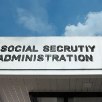 social-security-administration-word-signage-on-a-government-building-under-a-blue-sky social-security-administration-word-signage-on-a-government-building-under-a-blue-sky
